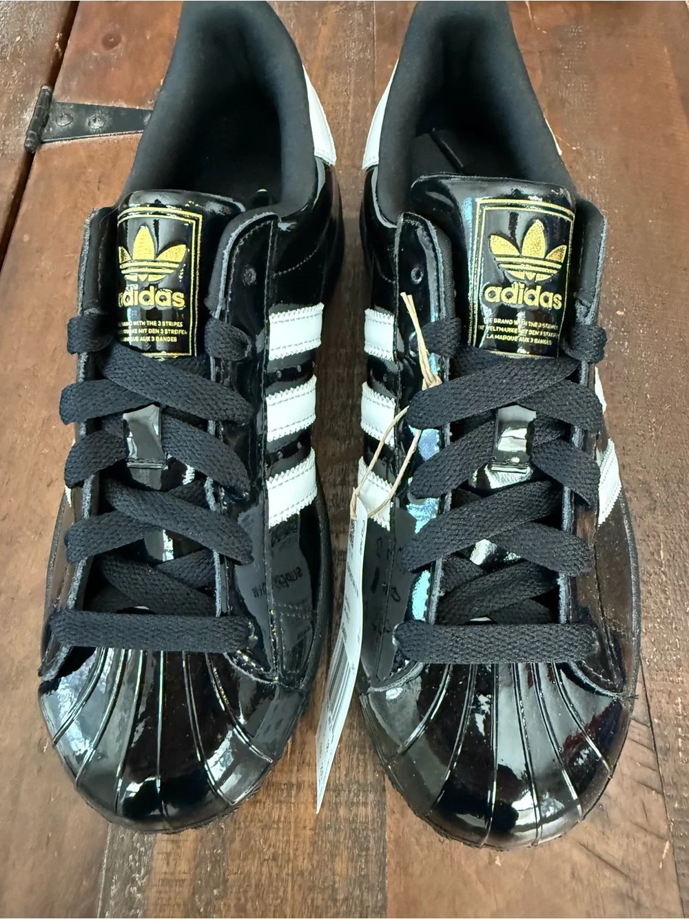 adidas Kids Black and White Patent Shell-Toe Sneakers with Gold Logo